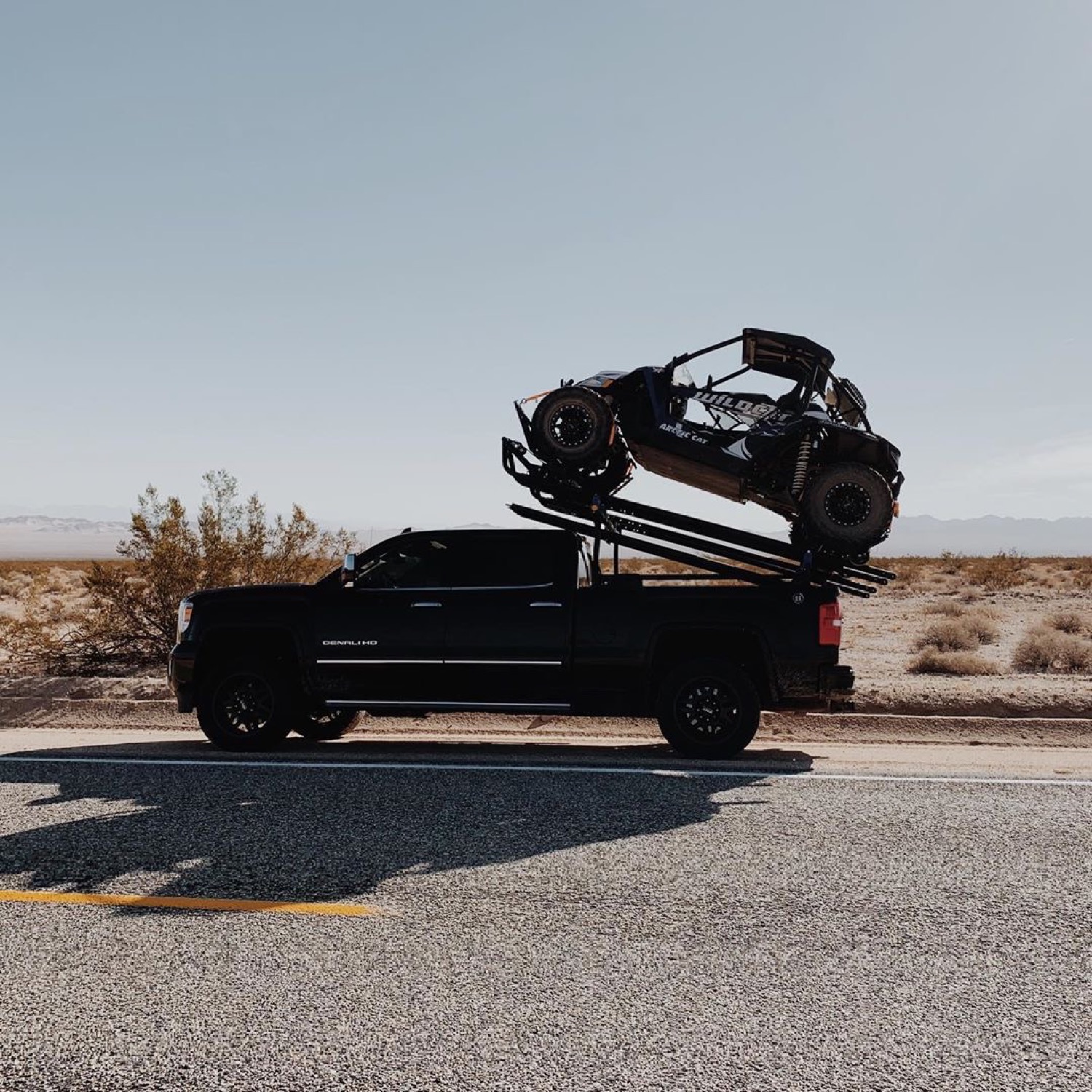Desert highway with a UTV up top