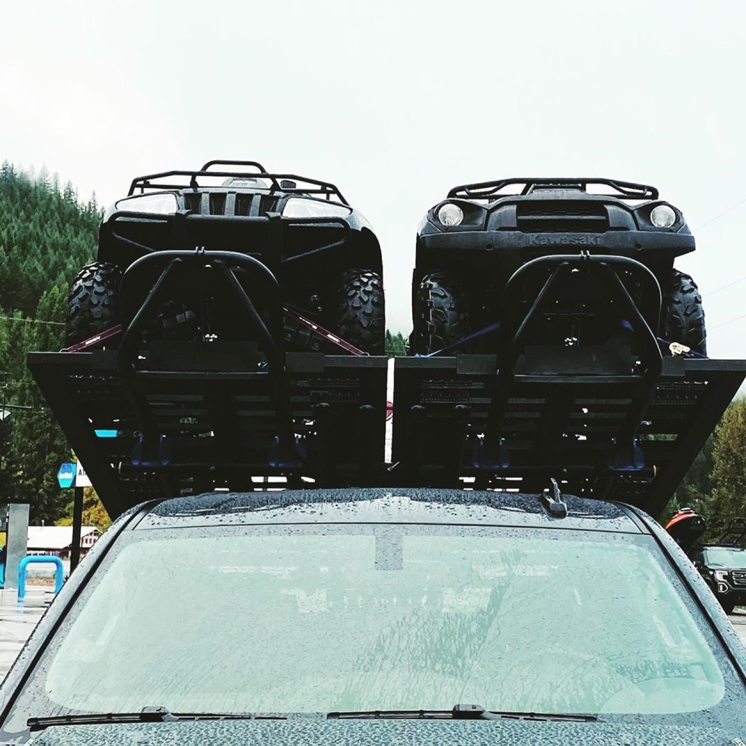 Two ATVs, seen over the hood