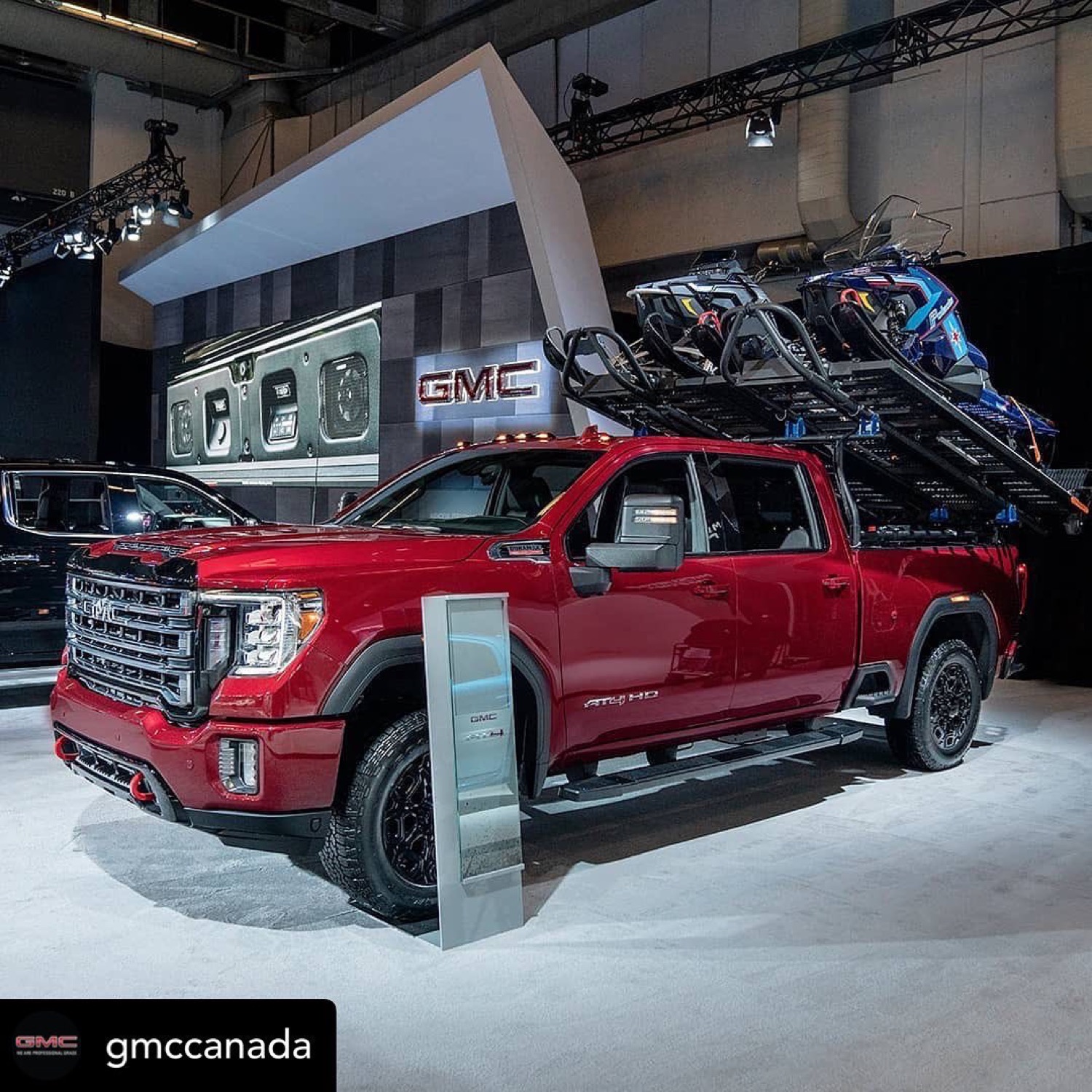 Frostrack on a GMC show truck, fully loaded with snowmobiles