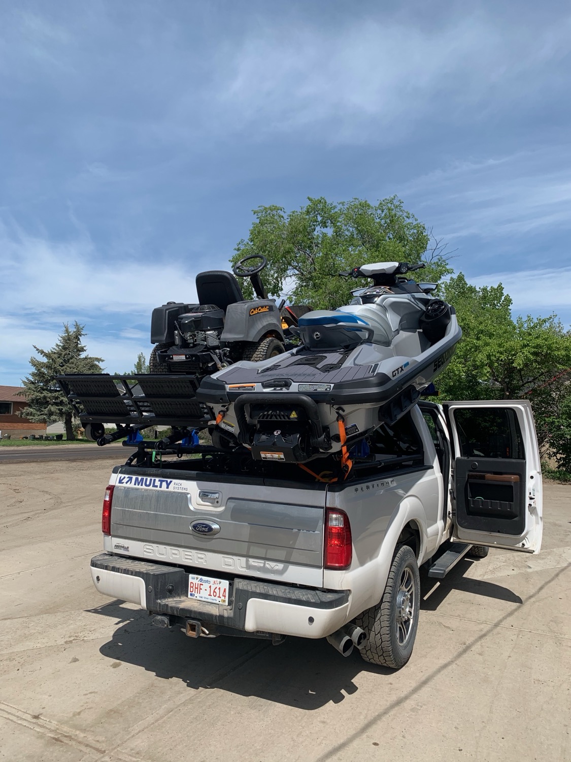Lawn tractor and Sea-Doo, rear view